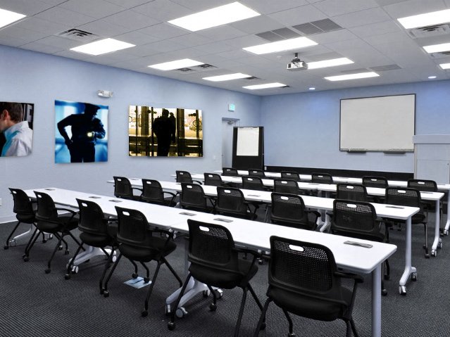 Security training classroom with rows of tables and chairs
